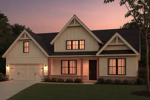 Modern farmhouse style house with warm lights at sunset and a two-car garage on a green lawn